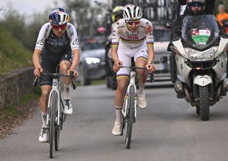 SIENA ITALY MARCH 08 LR Tom Pidcock of The United Kingdom and Q365 Pro Cycling Team and Tadej Pogacar of Slovenia and UAE Team EmiratesXRG compete in the breakaway during the 19th Strade Bianche 2025 Mens Elite a 213km one day race from Siena to Siena 320m UCIWT on March 08 2025 in Siena Italy Photo by Tim de WaeleGetty Images