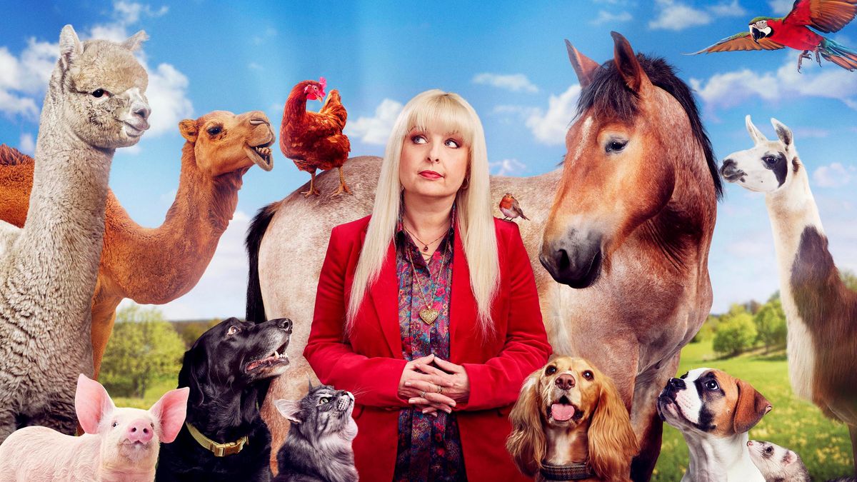 Beth Lee-Crowther surrounded by animals with a blue sky background.