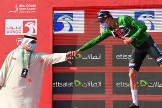 ABU DHABI UNITED ARAB EMIRATES FEBRUARY 21 Podium Mathieu van der Poel of The Netherlands and Team AlpecinFenix Green Points Jersey Celebration during the 3rd UAE Tour 2021 Stage 1 a 176km stage from Al Dhafra Castle to Al Mirfa Trophy Mask Social distancing Covid Safety Measures UAETour on February 21 2021 in Abu Dhabi United Arab Emirates Photo by Tim de WaeleGetty Images