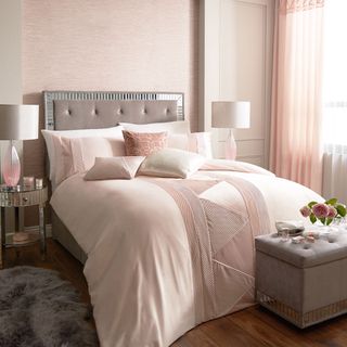 bedroom with pink decor and bedding