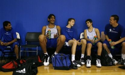 Satnam Singh Bhamara (left) takes a break after running drills in 2010: The then-14-year-old won an inaugural scholarship for talented teenage Indian athletes.