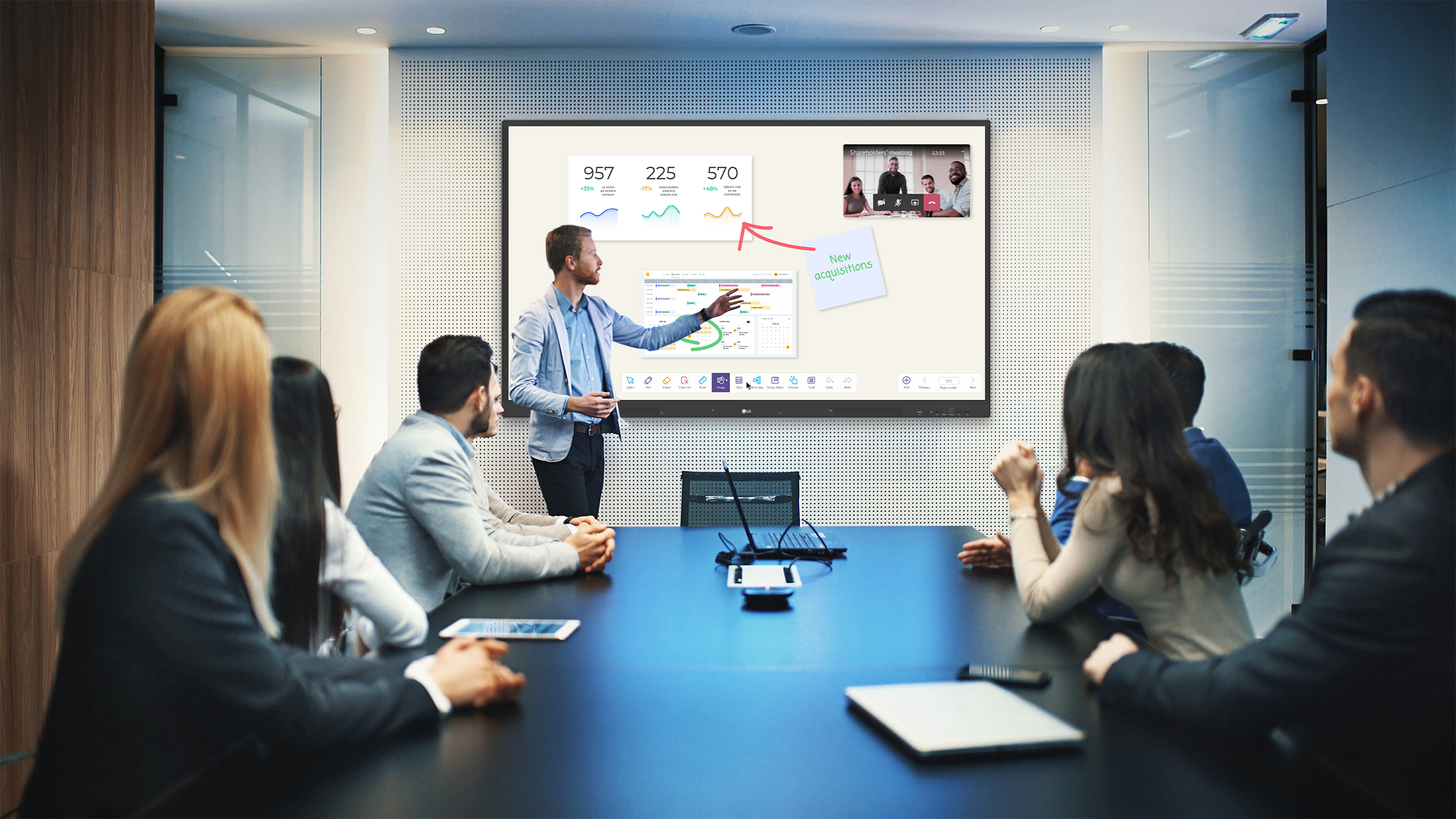 A man uses an LG display in a conference to display charts and presentation material.