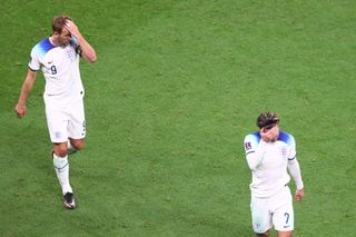 Grealish (R) and Kane (L) of England react during the FIFA World Cup Qatar 2022 Group B match between England and USA at Al Bayt Stadium in Al Khor, Qatar on November 25, 2022.