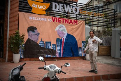 A sign showing Trump and Kim in Vietnam