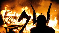 The Guizer Jarl or Chief of the Jarl viking squad is silhoutted by a burning viking longship during the annual Up Helly Aa Festival, Lerwick, Shetland Islands, January 26, 2010. Up Helly Aa c