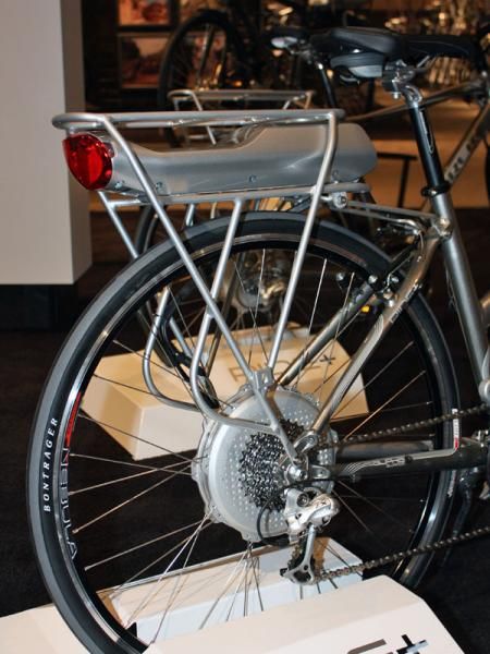 The rechargeable battery pack slots into the proprietary rear rack while the motor is wholly housed within the rear hub.