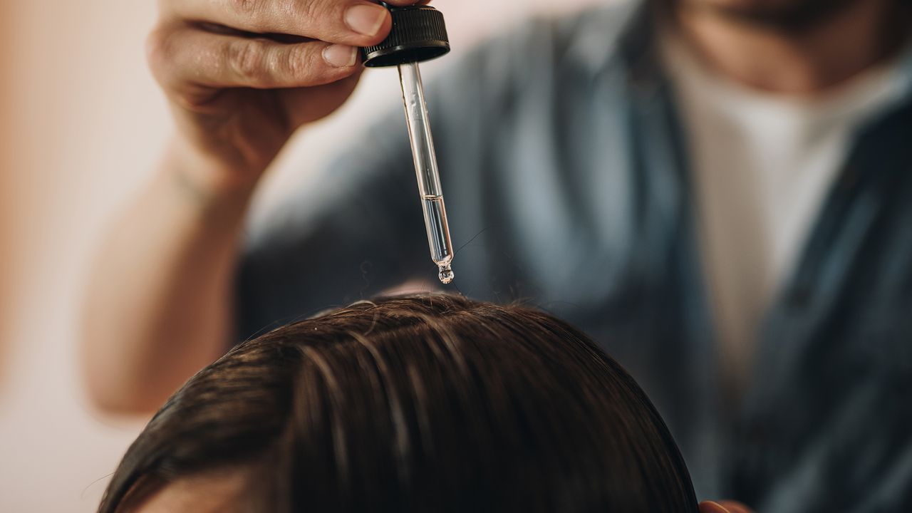 hair oil pipette above hair