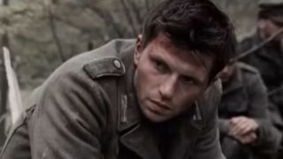 A soldier in a German uniform looking melancholy in Band of Brothers.