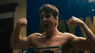 Miles Teller flexing his biceps and screaming in Bleed For This