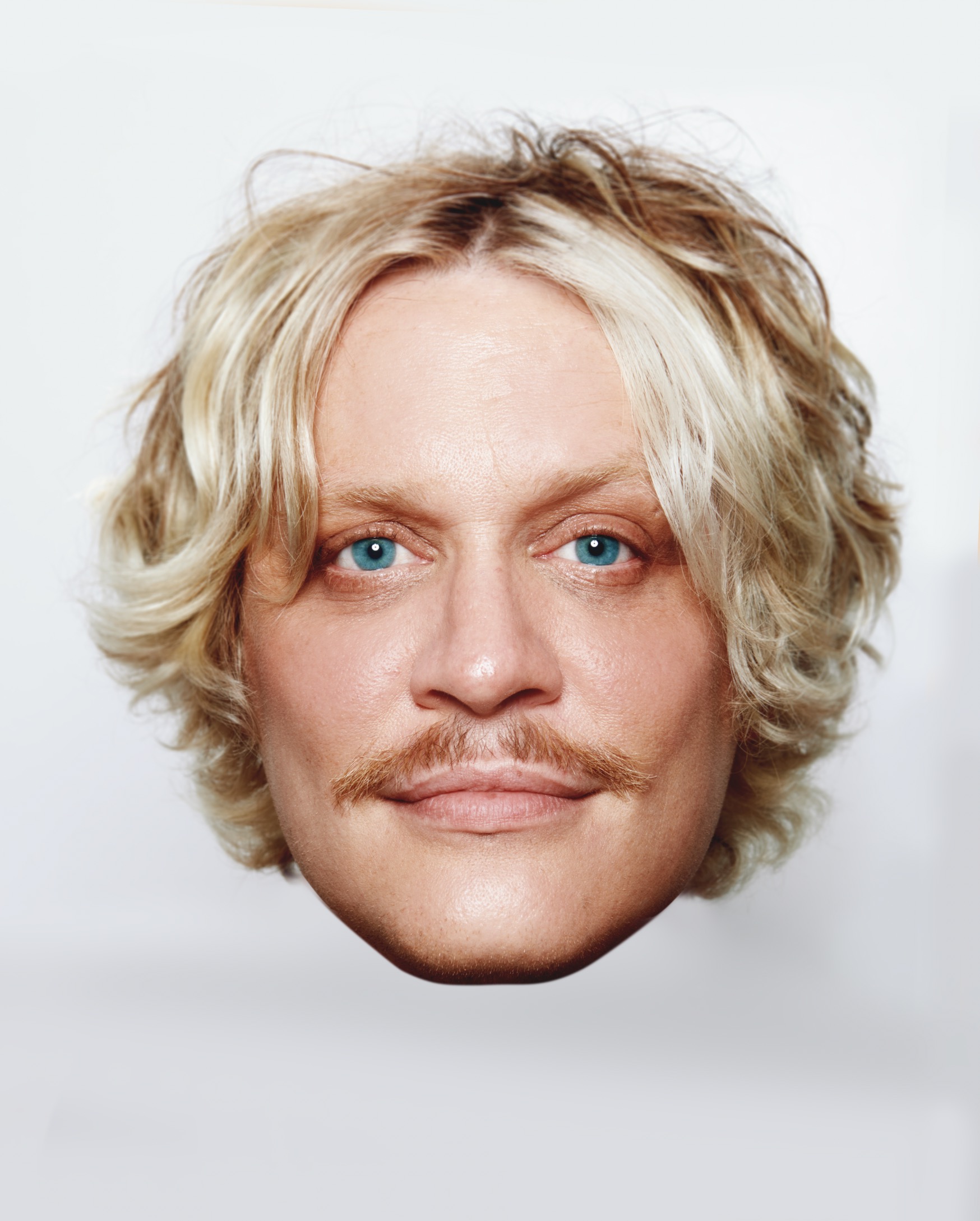 a white man with blue eyes and blonde hair