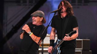 Brian Johnson from ACDC performs with Dave Grohl (R) of the Foo Fighters during the taping of the "Vax Live" fundraising concert at SoFi Stadium in Inglewood, California, on May 2, 2021. 