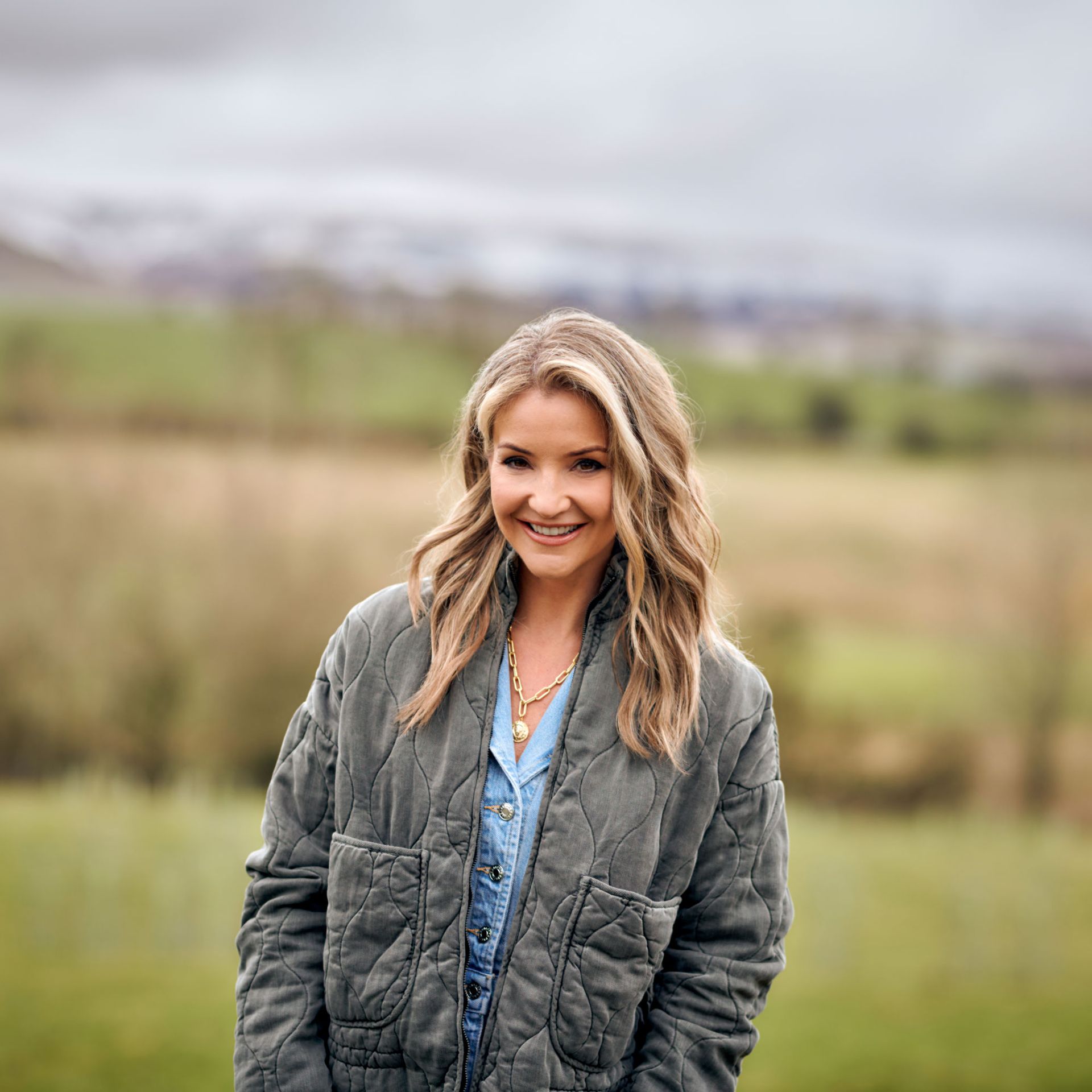 Helen Skelton standing in a field