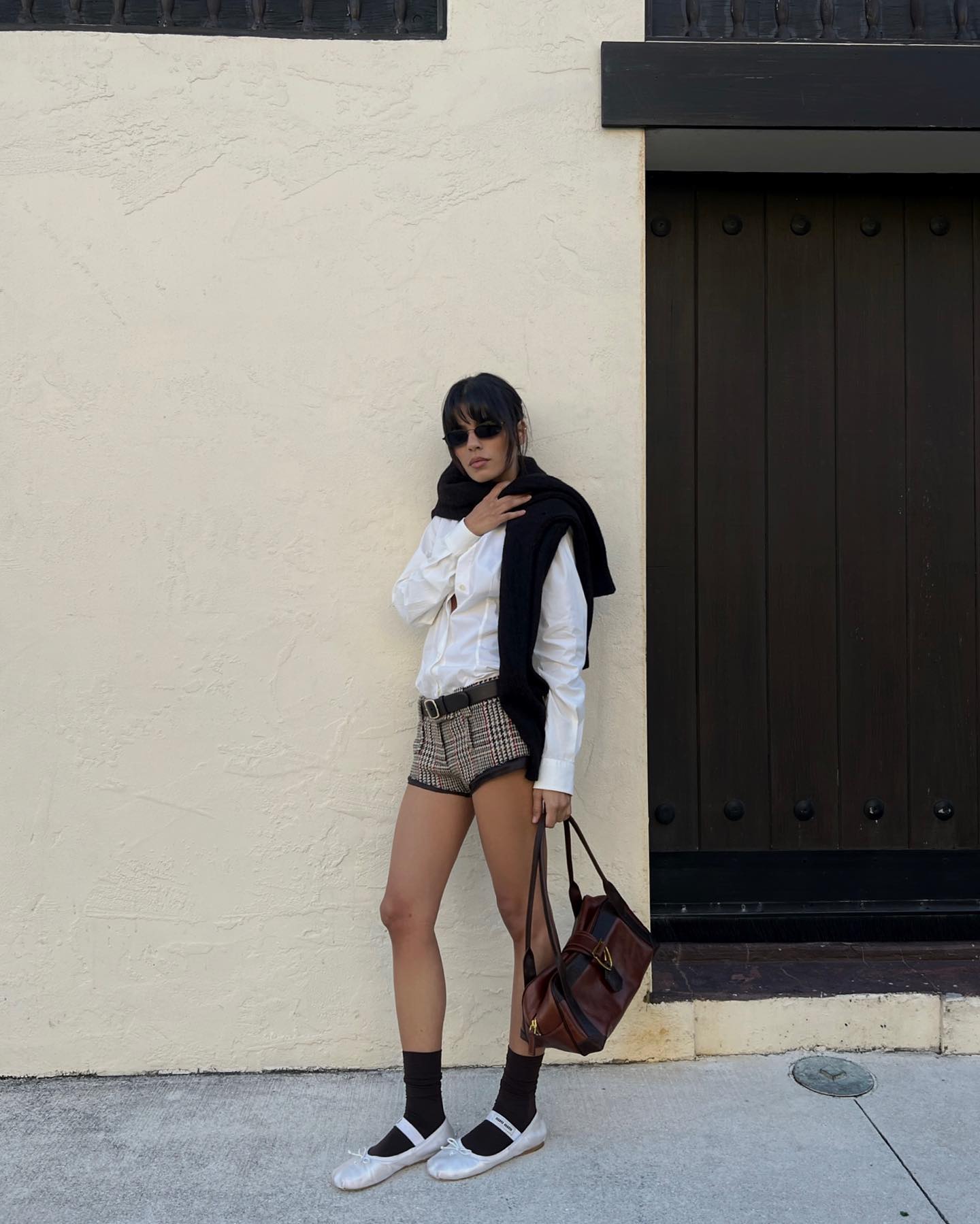 An image of @endlesslyloveclub wearing one of the most iconic shoes, Miu Miu ballet flats.