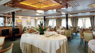 Food is served in the stately dining room or at the on-deck bar
