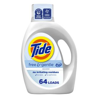 A white bottle of liquid laundry detergent with an orange and yellow circular logo with blue text