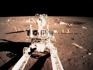 China's moon rover Yutu ("Jade Rabbit") rolls down a ramp on the Chang'e 3 lander after touching down on the moon's Bay of Rainbows on Dec. 14, 2013.