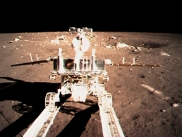 China&#039;s moon rover Yutu (&quot;Jade Rabbit&quot;) rolls down a ramp on the Chang&#039;e 3 lander after touching down on the moon&#039;s Bay of Rainbows on Dec. 14, 2013.