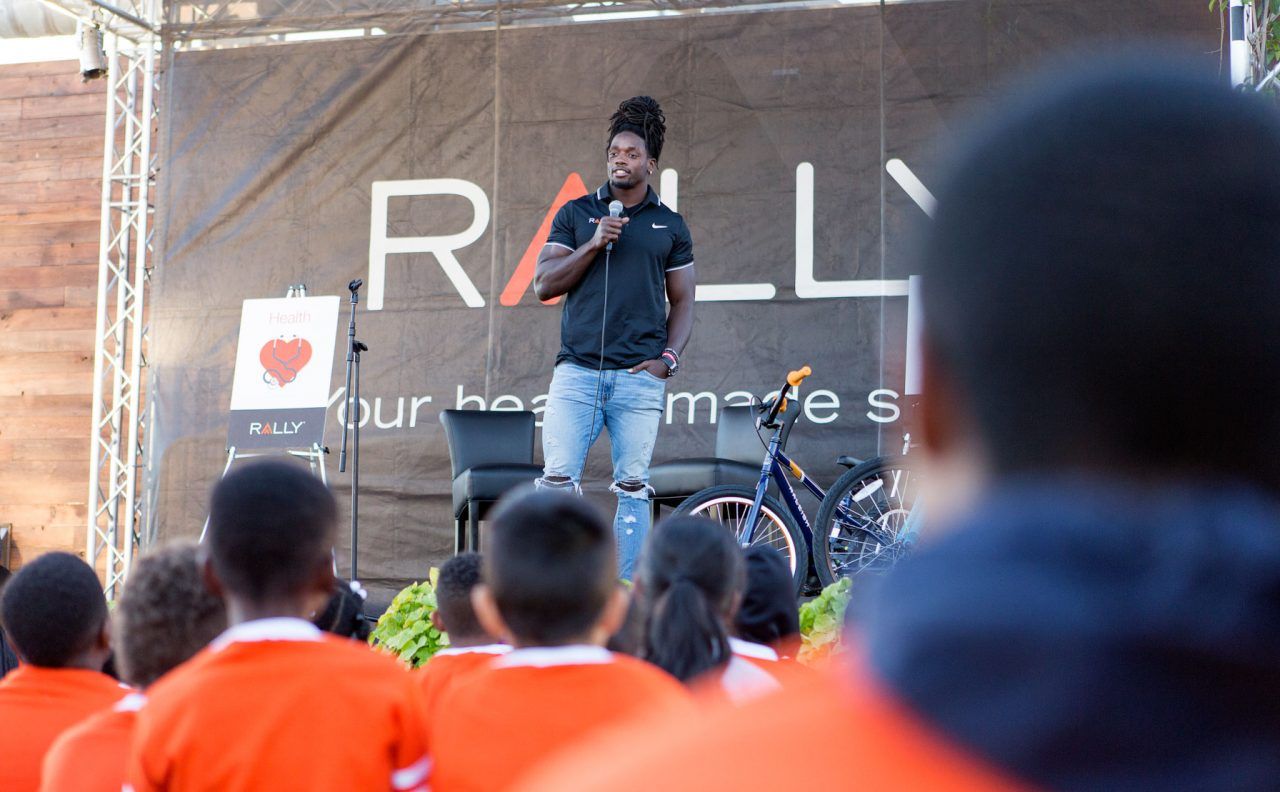 Melvin Gordon addresses the children during the bike build at the StubHub Center