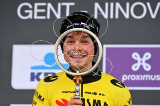 Jan Tratnik won the 2024 Omloop Het Nieuwsblad and celebrated on the podium