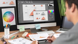 A graphic designer uses some of the best graphic design software for a logo design