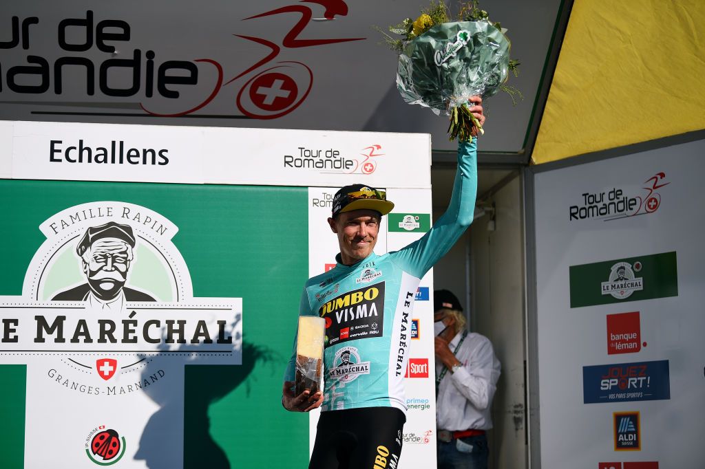 OULENSSOUSECHALLENS SWITZERLAND APRIL 28 Rohan Dennis of Australia and Team Jumbo Visma celebrates winning the turquoise leader jersey on the podium ceremony after the 75th Tour De Romandie 2022 Stage 2 a 1682km stage from challens to challens TDR2022 on April 28 2022 in OulenssousEchallens Switzerland Photo by Dario BelingheriGetty Images