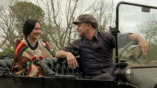 Leonardo DiCaprio's Ernest talks to Lily Gladstone's Mollie in a car.