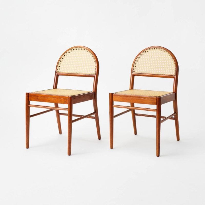 Two arch-shaped caned woven dining chairs is one of the best Target furniture pieces.