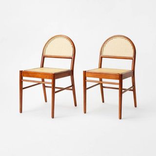 Two arch-shaped caned woven dining chairs is one of the best Target furniture pieces.