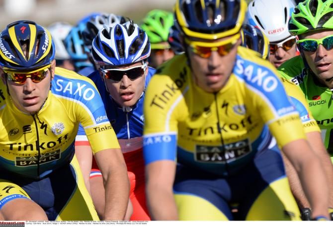 Arthur Vichot (FDJ) pokes his head out between two Tinkoff-Saxo riders