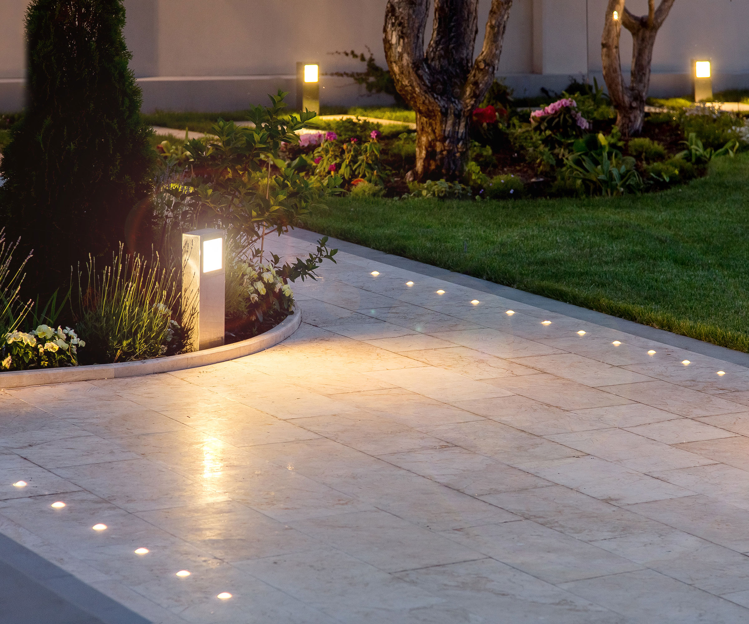 garden path with recessed lights, flowerbeds with garden lights and trees