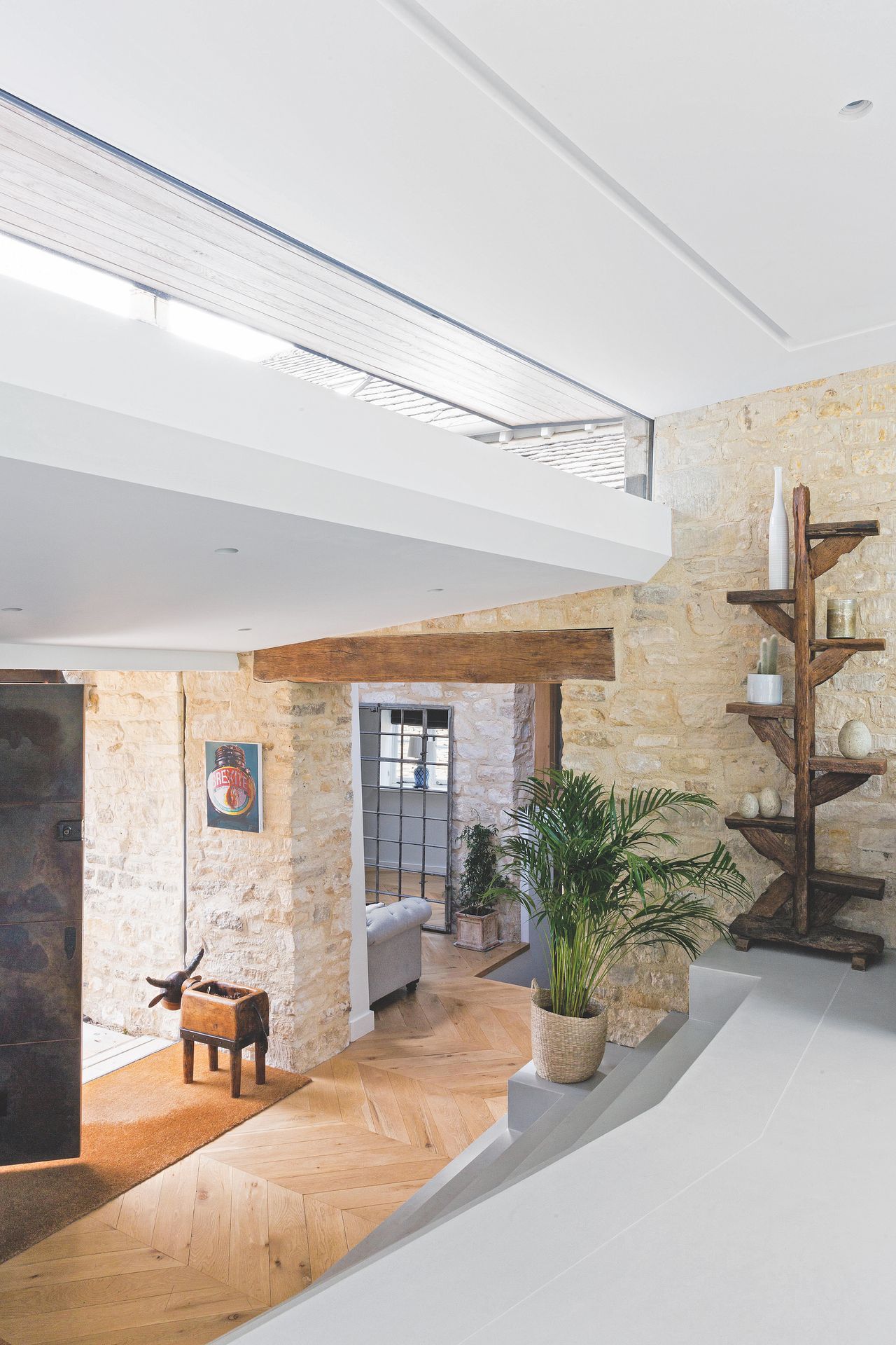 hallway in stone house with front doors