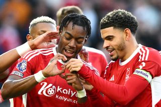 Anthony Elanga and Morgan Gibbs-White of Nottingham Forest are celebrating after scoring a goal to make it 1-0 and are gesturing in honor of Morgan's newly born baby, Greyson, during the Premier League match between Nottingham Forest and Brighton and Hove Albion at the City Ground in Nottingham, on November 25, 2023. (Photo by MI News/NurPhoto via Getty Images)