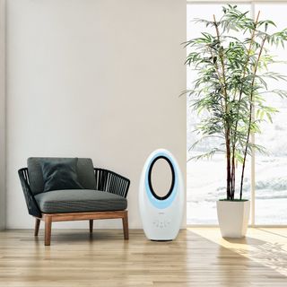 Aldi bladeless fan next to chair and plant