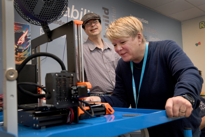 Laurie Dale works on a 3D printer at Ability Beyond