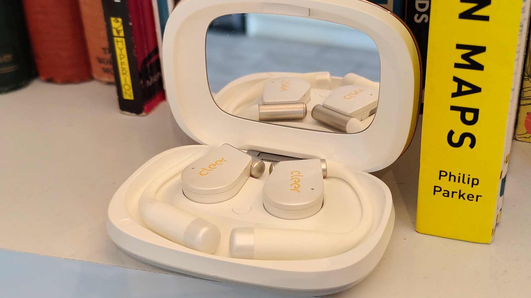 The Cleer Arc 5 buds in their case.