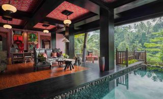 A lounge area with pool at The Lodge at Capella Ubud — Bali