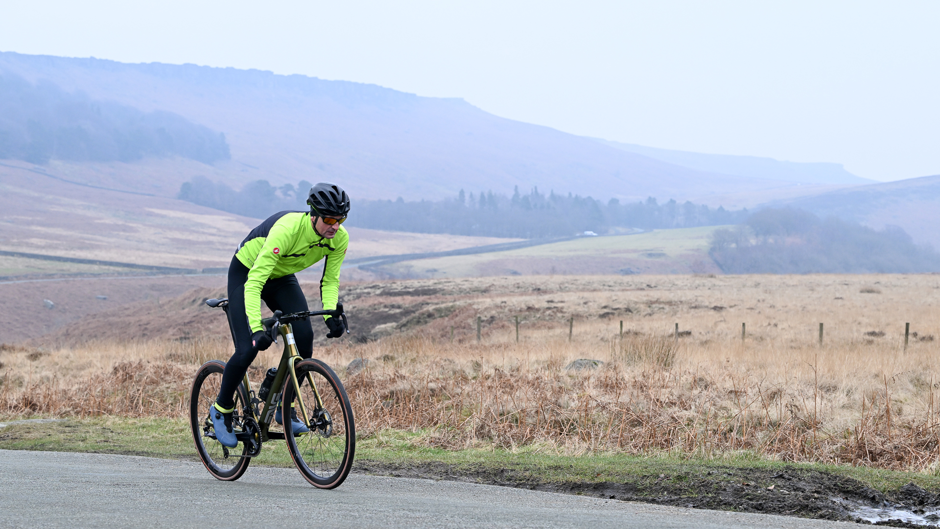 Man riding an ENVE Fray road bike on a misty road