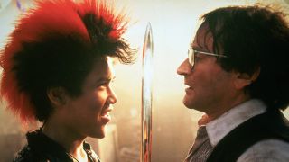 Dante Basco gleefully holds a sword between him and Robin Williams in Hook.