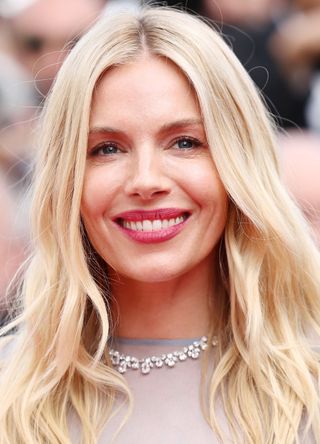 Sienna Miller attends the "Horizon: An American Saga" Red Carpet at the 77th annual Cannes Film Festival at Palais des Festivals on May 19, 2024 in Cannes, France.