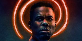 Chris Rock stands in front of a spiral halo in Spiral: From the Book of Saw's poster.