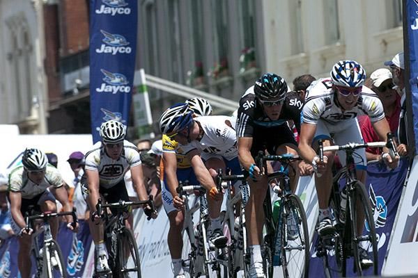 Graeme Brown (third wheel) riding for the Urban team looks around to check on the movements of others in the peloton.