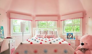 A bedroom fully painted in pink