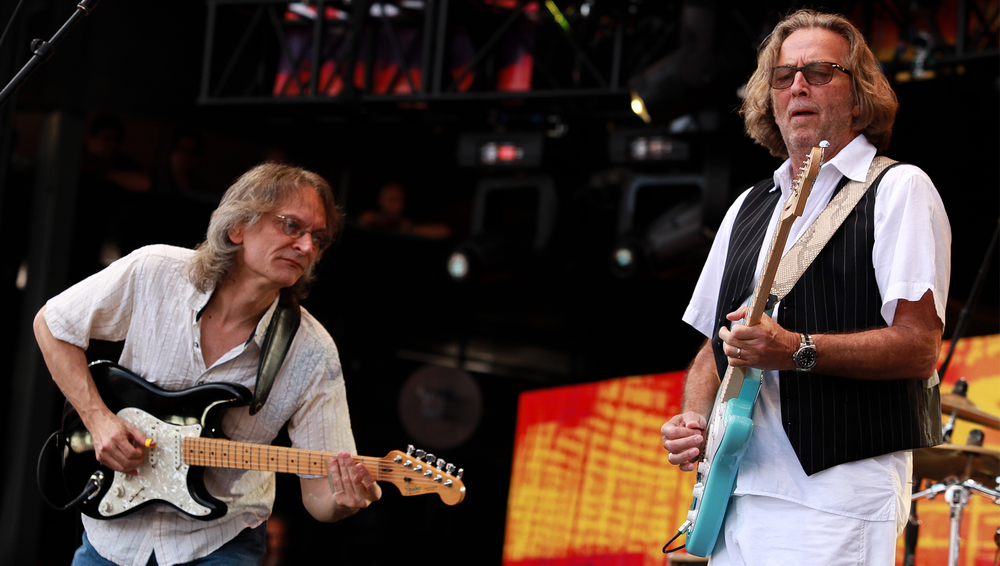 Guitarists Sonny Landreth and Eric Clapton performs onstage during the 2010 Crossroads Guitar Festival at Toyota Park on June 26, 2010 in Bridgeview, Illinois.