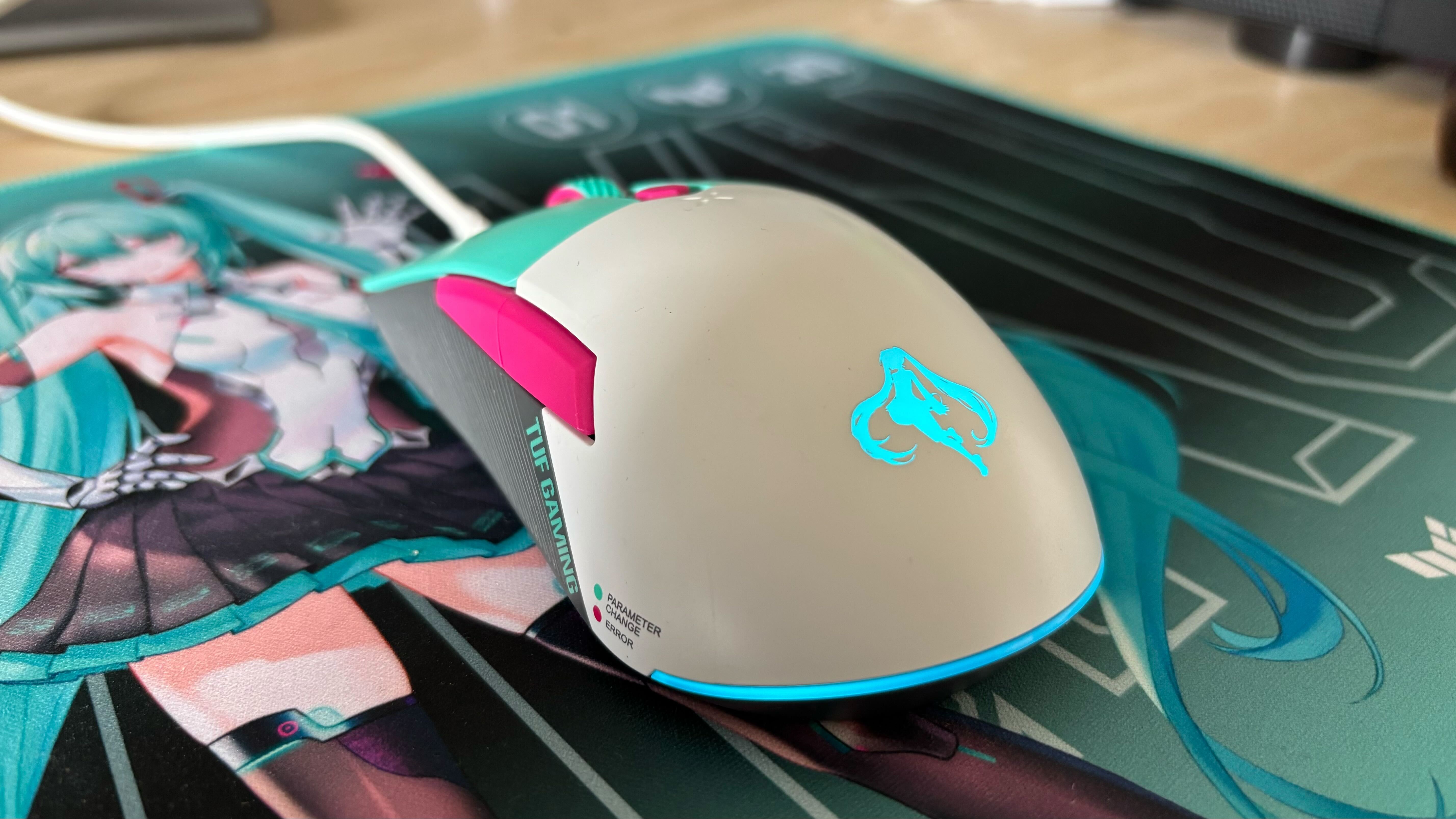 Miku x TUF Gaming mouse plugged in with blue Hatsune Miku icon lit up against TUF Gaming mouse mat