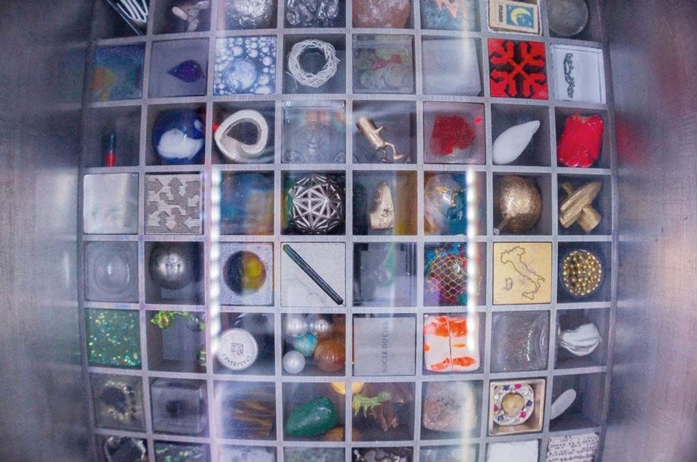 NanoRacks&#039; Nanolab camera view of the 64 works of art comprising the Moon Gallery test payload now onboard the International Space Station for the next 10 months.