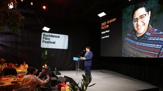 Absen LED displays illuminate the Sundance Film Festival, shown behind a presenter at a podium here. 