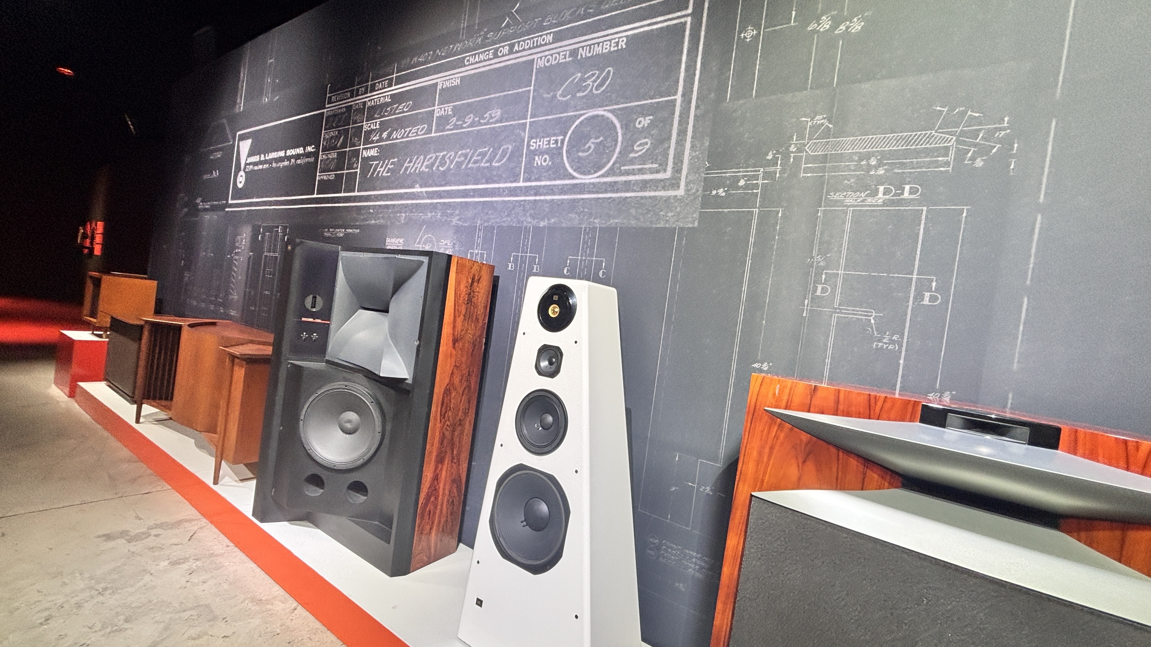 Range of JBL speakers in front of a wall