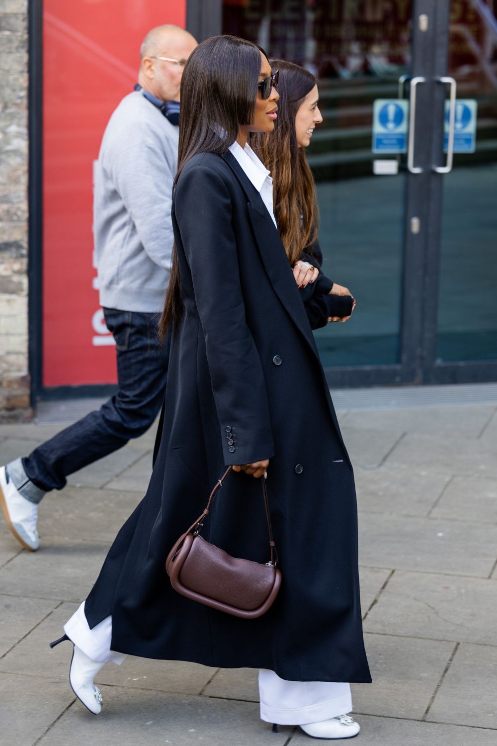 Naomi Campbell carrying the JW Anderson Bumper bag