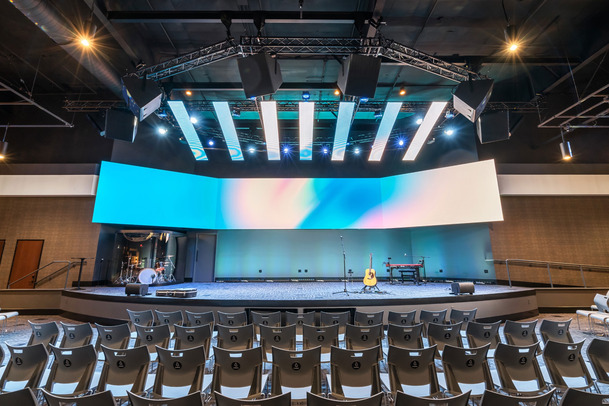 A church auditorium amps up for musical performances.