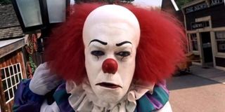 It (1990) Pennywise stares out from the photo album
